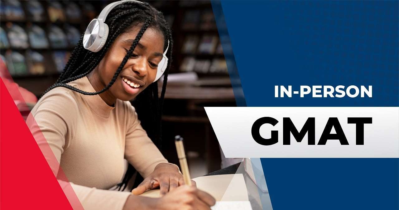A smiling female student studying in GMAT class